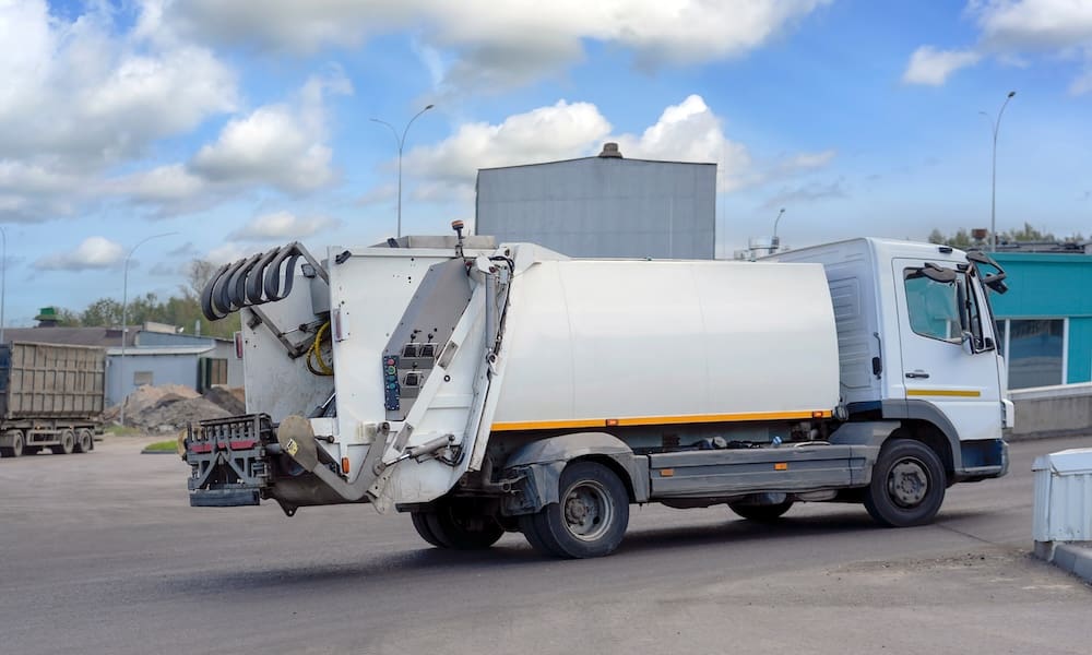 Waste hauling fleet parked in yard prior to residential collection routes