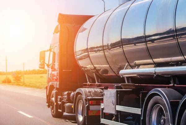 Big gas-tank goes on highway against the sky